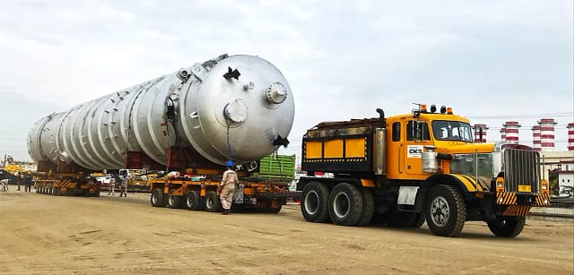 Huge equipment being moved by a truck