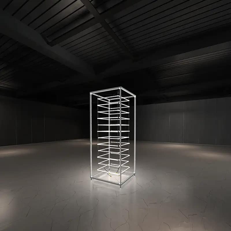 Illuminated WaveLight® Casonara Tower showcasing customizable event signage in a sleek exhibition space.