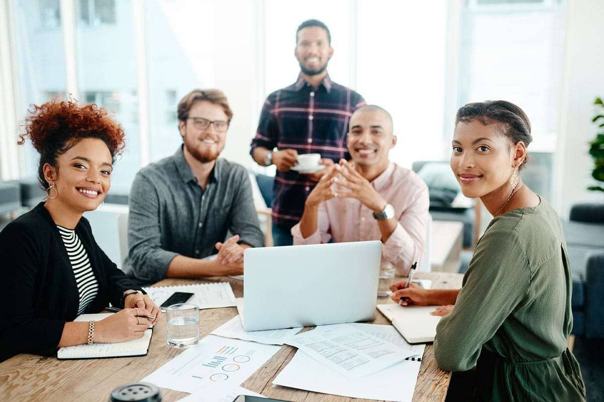 5 employees having a meeting