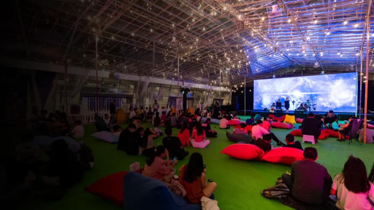 indoor concert with cushion sitting
