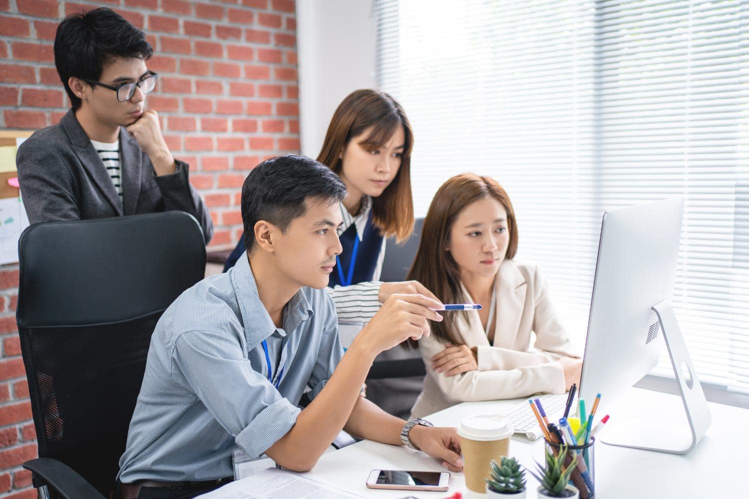 employees starting into a computer