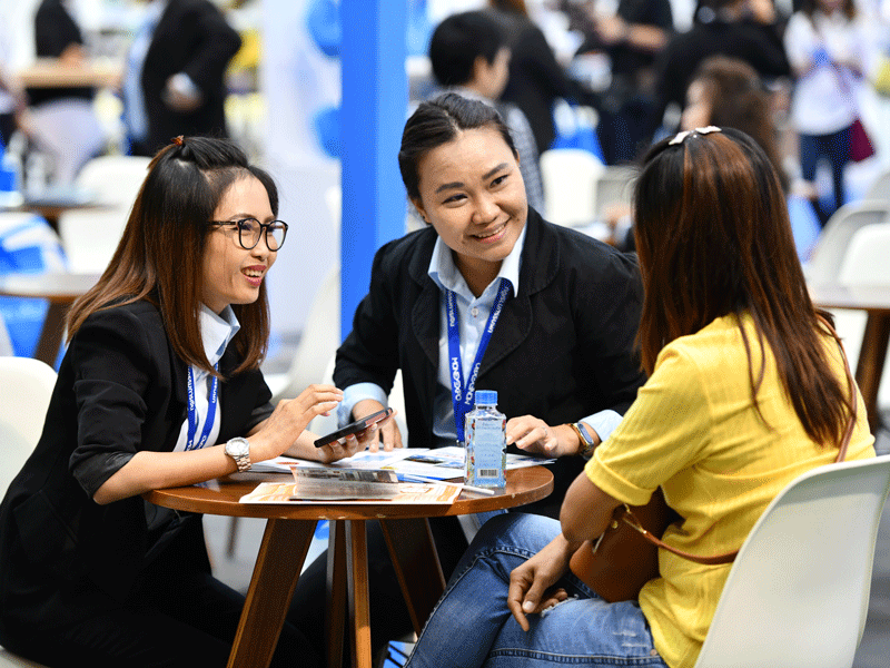 two business women talking to a civilian